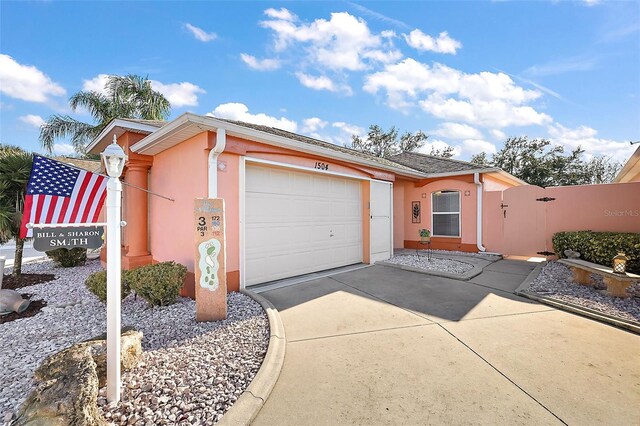 ranch-style home with a garage