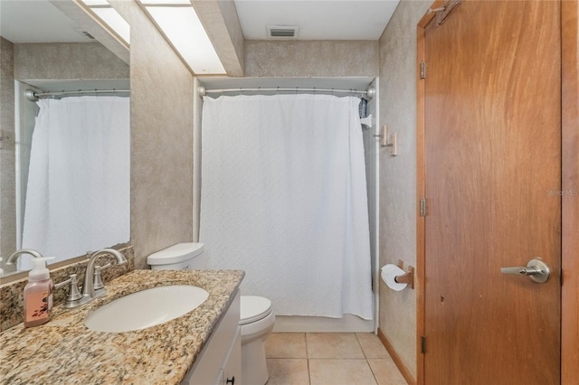 bathroom featuring a shower with curtain, tile patterned floors, toilet, and vanity