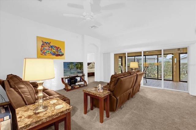 carpeted living room featuring ceiling fan