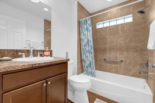 full bathroom with vanity, wood-type flooring, shower / tub combo, and toilet