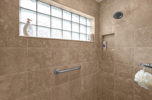 bathroom with tiled shower