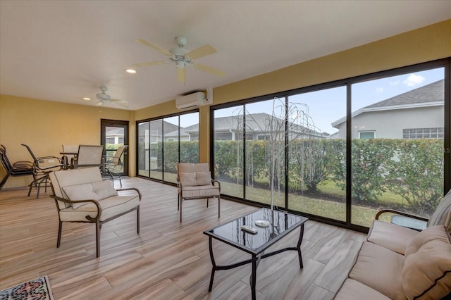 sunroom featuring a wall mounted air conditioner and ceiling fan