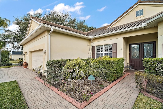 view of side of home featuring a garage