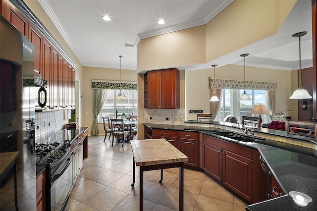 kitchen featuring ornamental molding, decorative light fixtures, and black appliances