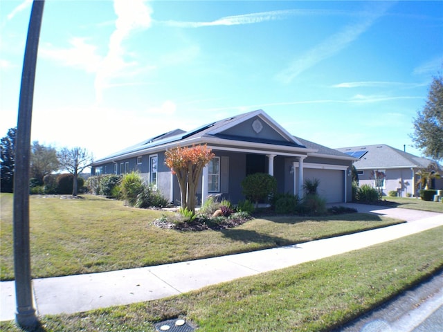 ranch-style house featuring a garage and a front yard