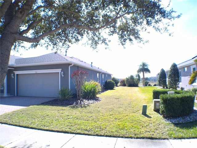 view of property exterior featuring a garage and a yard