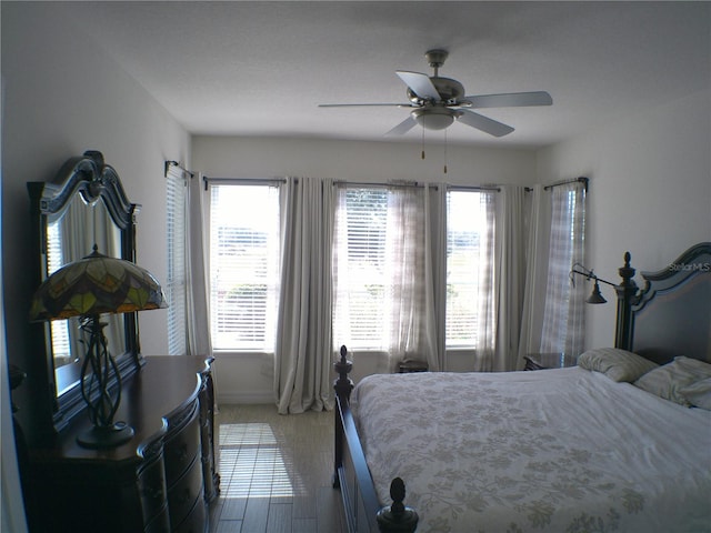 bedroom featuring hardwood / wood-style flooring and ceiling fan