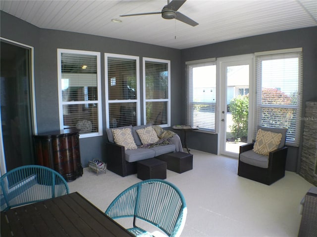 sunroom / solarium with a wealth of natural light and ceiling fan