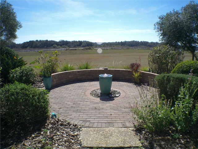 view of patio / terrace featuring a rural view