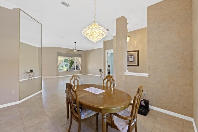 dining space with ornamental molding, ceiling fan with notable chandelier, and light tile patterned floors