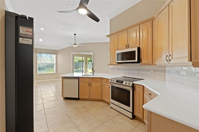 kitchen featuring backsplash, stainless steel appliances, kitchen peninsula, and light brown cabinets