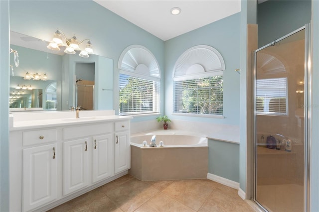 bathroom with tile patterned floors, plus walk in shower, and vanity