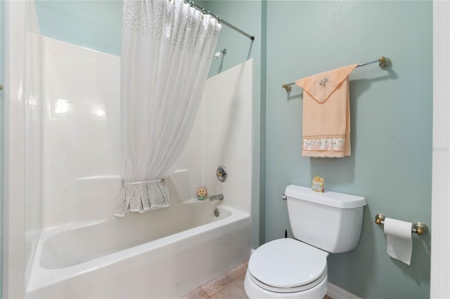 bathroom with shower / bath combo, tile patterned floors, and toilet