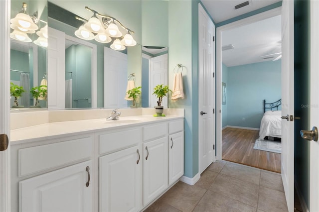 bathroom with vanity, tile patterned floors, a chandelier, and a shower with curtain