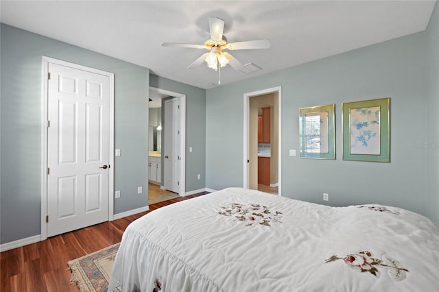 bedroom featuring ensuite bathroom, hardwood / wood-style floors, and ceiling fan