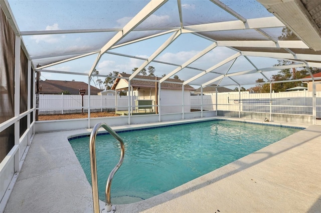 view of pool featuring a lanai, a patio area, a fenced backyard, and a fenced in pool