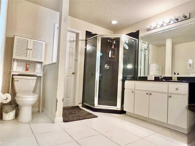 full bath with a stall shower, vanity, toilet, and a textured ceiling