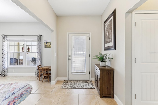 foyer featuring light tile patterned flooring