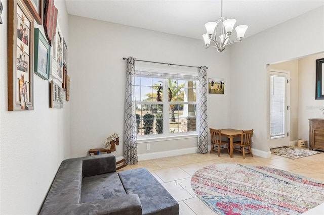 living area featuring light tile patterned flooring and a chandelier