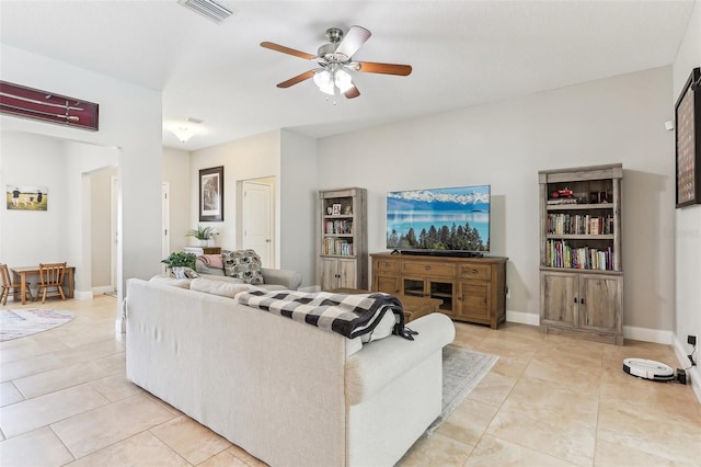 living room featuring light tile patterned flooring and ceiling fan