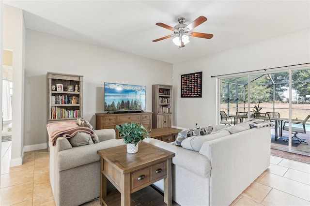 living room with light tile patterned floors and ceiling fan