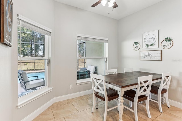 dining area featuring light tile patterned floors and ceiling fan