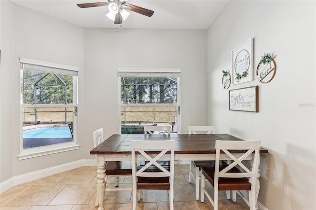 tiled dining area featuring ceiling fan