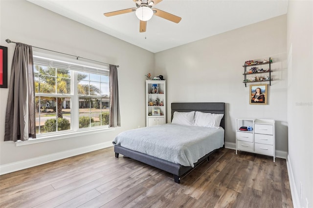 bedroom featuring ceiling fan and dark hardwood / wood-style floors