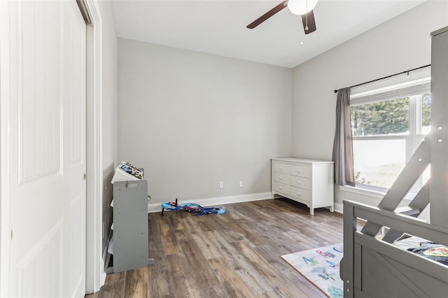 bedroom featuring hardwood / wood-style flooring and ceiling fan