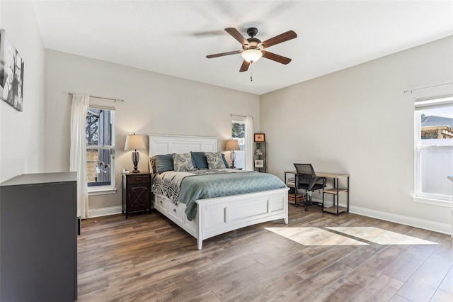 bedroom featuring ceiling fan and dark hardwood / wood-style flooring