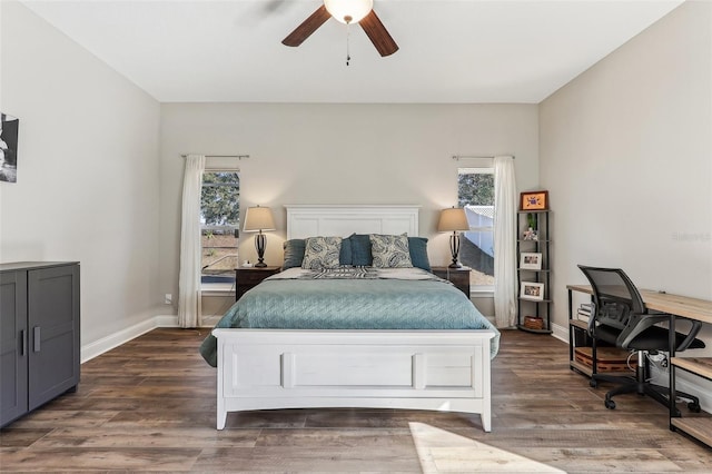 bedroom with ceiling fan and dark hardwood / wood-style floors