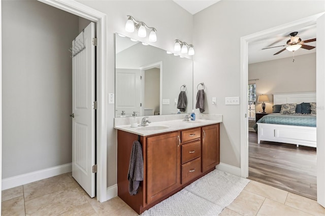 bathroom with ceiling fan, tile patterned floors, and vanity