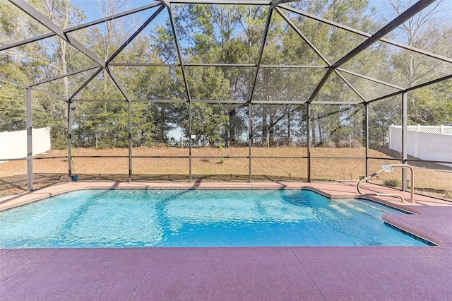 view of swimming pool with a patio and glass enclosure