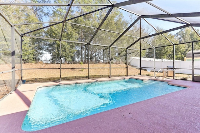 view of pool with a lanai and a patio area