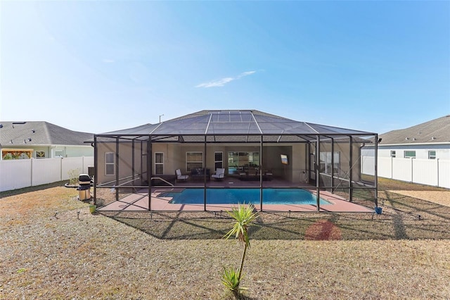 view of swimming pool with a lanai and a patio area