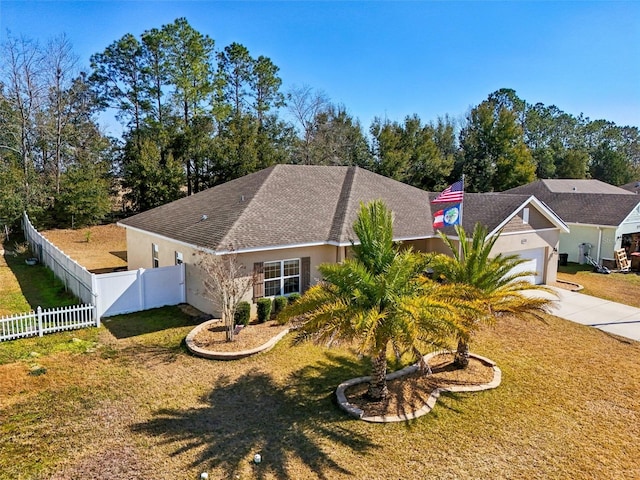 view of front of house with a garage and a front yard