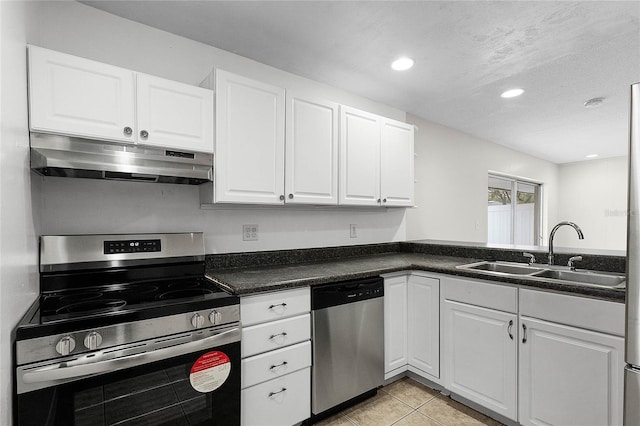 kitchen featuring appliances with stainless steel finishes, sink, and white cabinets