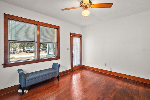 sitting room featuring hardwood / wood-style floors and ceiling fan