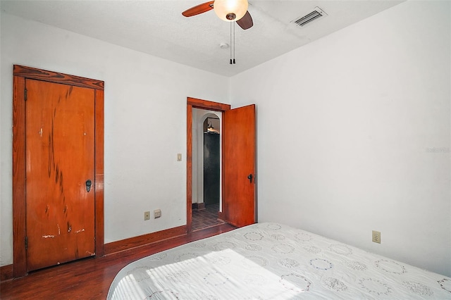 bedroom featuring ceiling fan and hardwood / wood-style floors