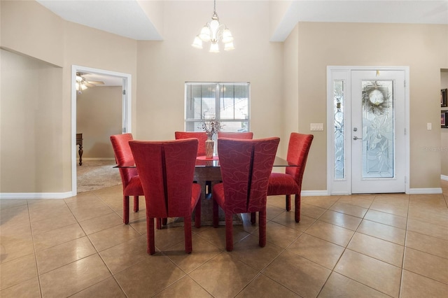 dining area featuring a chandelier and tile patterned flooring