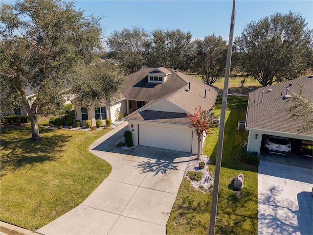 view of front of home with a garage and a front yard