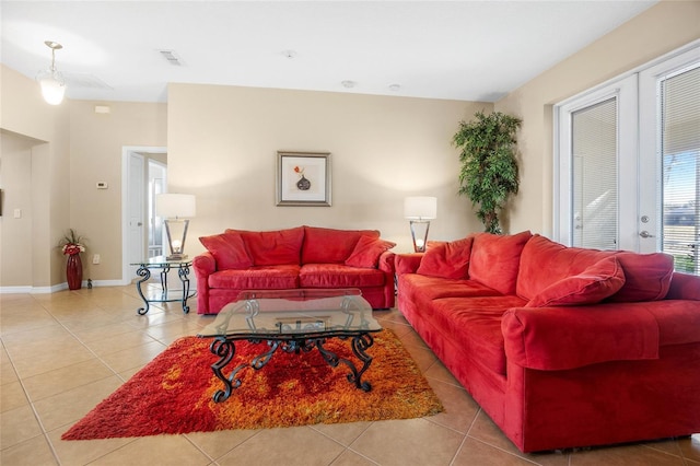 living room featuring light tile patterned flooring and french doors