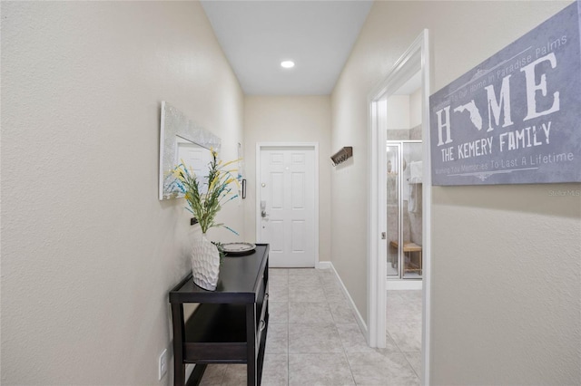 corridor featuring light tile patterned floors