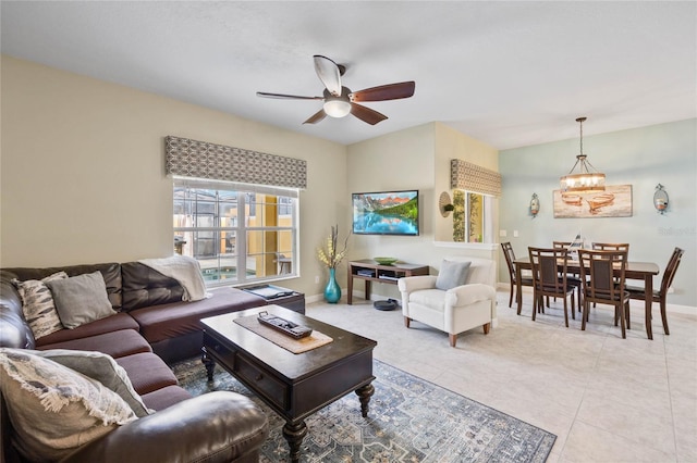 living room featuring light tile patterned floors and ceiling fan