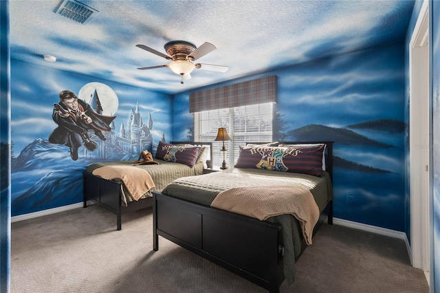 carpeted bedroom with ceiling fan and a textured ceiling