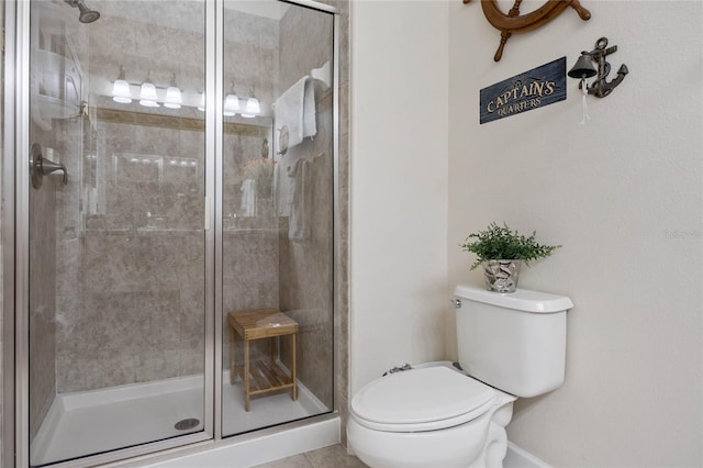 bathroom with toilet and an enclosed shower