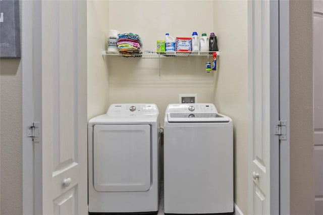 laundry area with separate washer and dryer