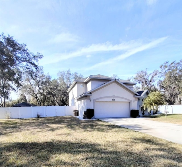 view of side of home featuring a garage and a lawn