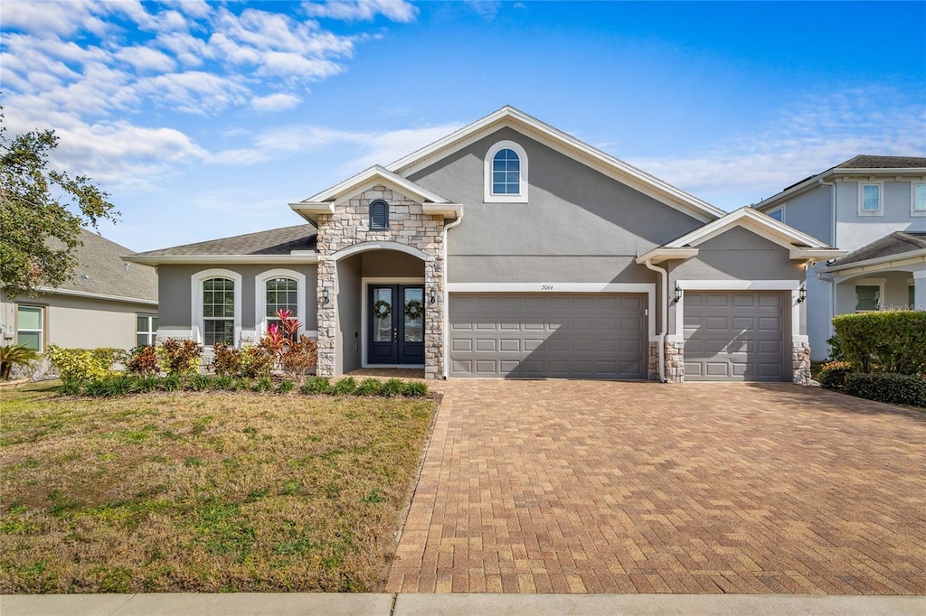 view of front of house with french doors and a front yard