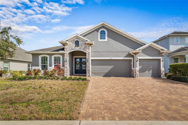 view of front of property with a front yard and french doors